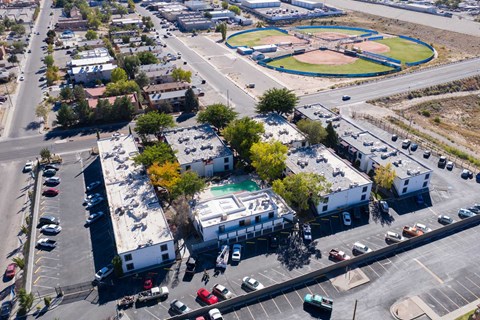 an aerial view of a city with buildings and cars